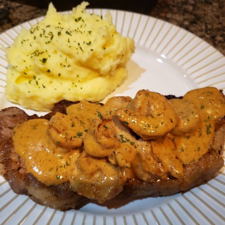 Savory Surf and Turf Delight: Steak in Creamy Cajun Shrimp Sauce