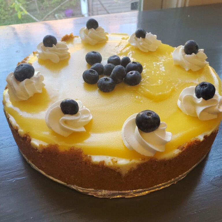 Zesty Lemon Cheesecake with Lemon Curd Topping